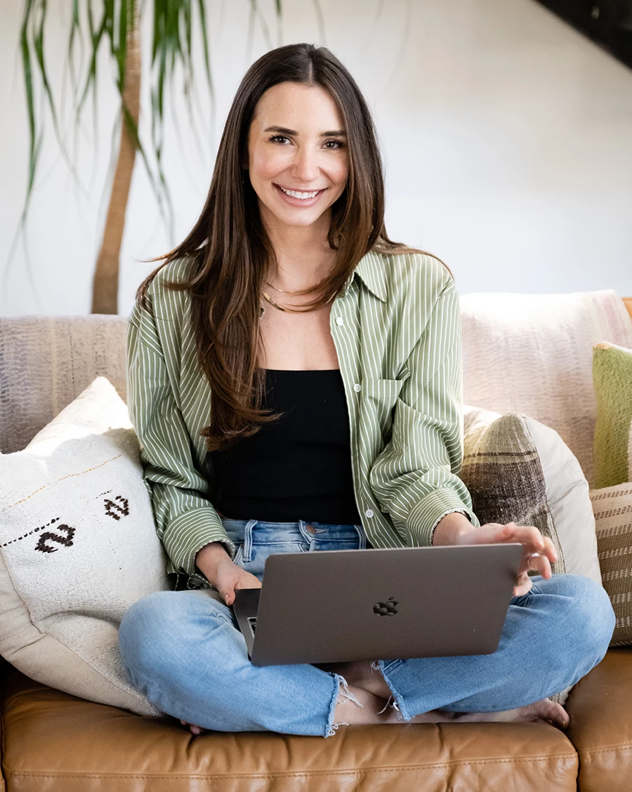 Me sitting on a leather couch working on my computer